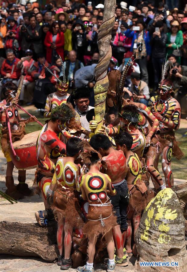 People of Yi ethnic group present their ancestors' way to start a hand drill fire during the annual fire worshipping festival, which falls on the third day of the second month in the Chinese lunar calendar at Xiyi Township under Mile City, southwest China People of Yi ethnic group present their ancestors